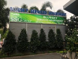 a building with a banner on the side of it at Bluesky Serviced Apartment Airport Plaza in Ho Chi Minh City