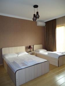 Voodi või voodid majutusasutuse Hotel Nikala toas