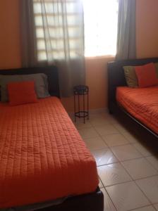 Un pat sau paturi într-o cameră la Sueños del Mar