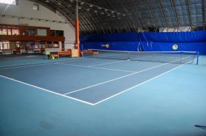 a tennis court with a net on it at Penzión Teniscentrum in Tatranská Lomnica +127 photos