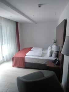 Postel nebo postele na pokoji v ubytování Aparthotel Miramare