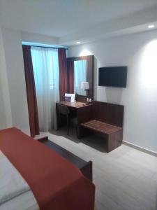 TV a/nebo společenská místnost v ubytování Aparthotel Miramare
