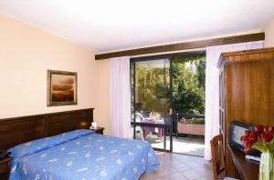 Postel nebo postele na pokoji v ubytování Balletti Park Hotel + 37 fotografií