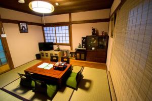 an overhead view of a living room with a table and chairs at Jizo House in Kyoto