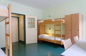 Cama ou camas em um quarto em Jugendherberge Wien - Myrthengasse