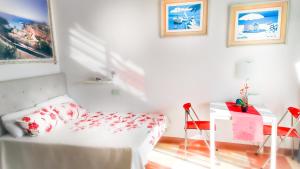 Postel nebo postele na pokoji v ubytování Elena Studio + 34 fotografií