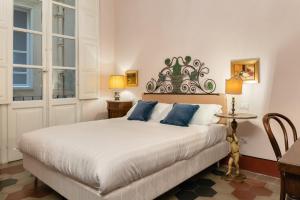 Ένα ή περισσότερα κρεβάτια σε δωμάτιο στο Bellezza Suites
