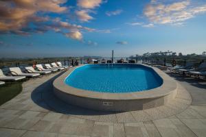 a swimming pool on the roof of a building at Queen of Hansa - 04 & 07 Nights from Luxor Every Monday - 03 Nights from Aswan Every Friday in Luxor