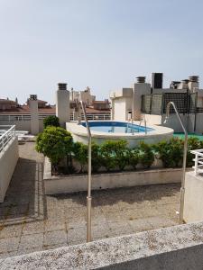 Bazén v ubytovaní El Pescador Park Cozy Apartment alebo v jeho blízkosti