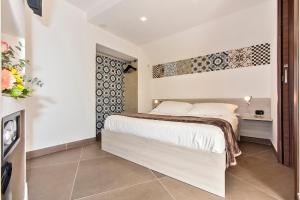 Postel nebo postele na pokoji v ubytování San Giorgio Palace Hotel Ragusa Ibla