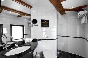 a bathroom with a sink and a toilet at 71 Nyhavn Hotel in Copenhagen