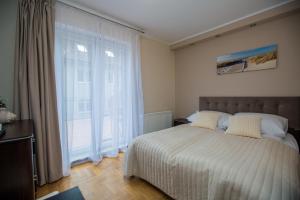 Posteľ alebo postele v izbe v ubytovaní Savona Świnoujście