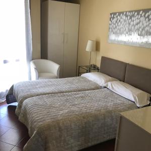 A bed or beds in a room at Claudio Appartamenti
