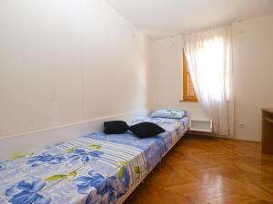 Postel nebo postele na pokoji v ubytování Apartments and rooms Novigrad 1624