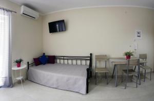 A bed or beds in a room at Lalezas Studios