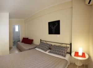 A bed or beds in a room at Lalezas Studios