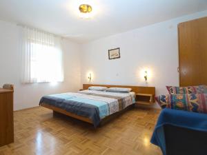Postel nebo postele na pokoji v ubytování Apartments and rooms Novigrad 1624
