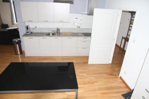 Η κουζίνα ή μικρή κουζίνα στο Appartement Courcelles