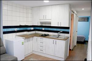Kuchyň nebo kuchyňský kout v ubytování Apartamento Baluarte