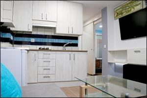 Kuchyň nebo kuchyňský kout v ubytování Apartamento Baluarte