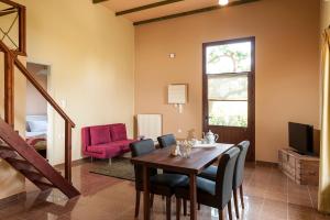 a dining room with a table and chairs at Filio House in Stalos