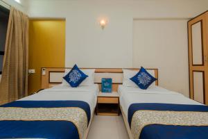 Postel nebo postele na pokoji v ubytování Hotel Mina International