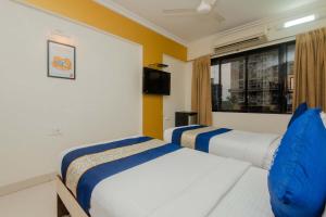 Postel nebo postele na pokoji v ubytování Hotel Mina International