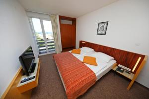 Postel nebo postele na pokoji v ubytování Hotel Donat - All Inclusive