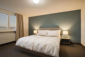Le Domaine (Swiss Lodge)客房内的一张或多张床位