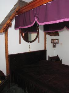 Katil atau katil-katil dalam bilik di Pensiunea Ana Maria