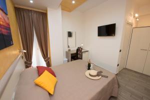 a living room with a table and a couch at B&B Sunlight Tropea in Tropea
