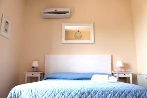 Кровать или кровати в номере B&B Nettuno San Leone