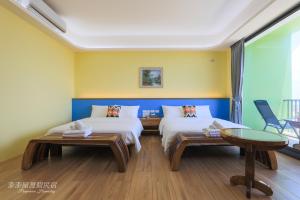 Postel nebo postele na pokoji v ubytování Pon Pon Wu Homestay