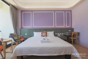 Postel nebo postele na pokoji v ubytování Pon Pon Wu Homestay