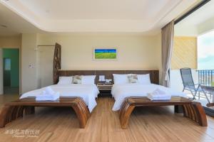 Postel nebo postele na pokoji v ubytování Pon Pon Wu Homestay