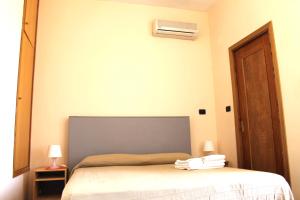Letto o letti in una camera di B&B Nettuno San Leone