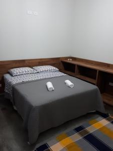 מיטה או מיטות בחדר ב-Chácara Leolud