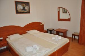 Postel nebo postele na pokoji v ubytování Apartments Maja Lopar