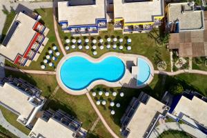 an overhead view of a pool at a resort at All Senses Nautica Blue Exclusive Resort & Spa - All Inclusive in Fánai