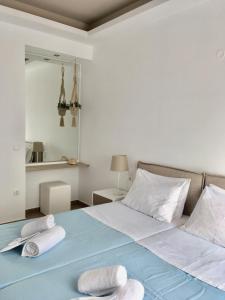A bed or beds in a room at Alegria Kefalonia