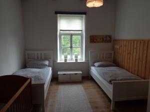 Postel nebo postele na pokoji v ubytování Ferienwohnung Sonne im Gästehaus Heeren