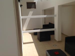 a room with two bunk beds and a piano at Hotel Corallo in Torre Santa Sabina