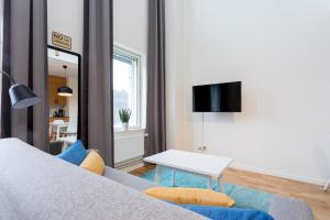 TV a/nebo společenská místnost v ubytování ApartDirect Hammarby Sjöstad
