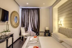A bed or beds in a room at Navona Living Rome