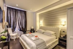 A bed or beds in a room at Navona Living Rome