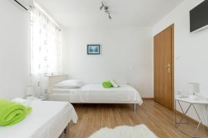 Ένα ή περισσότερα κρεβάτια σε δωμάτιο στο Apartmant Centar Split