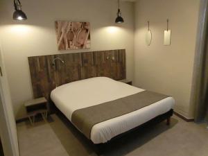 Postel nebo postele na pokoji v ubytování Hotel Sur Le Quai