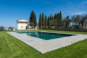 a swimming pool in the yard of a house at Olmofiorito in Lastra a Signa