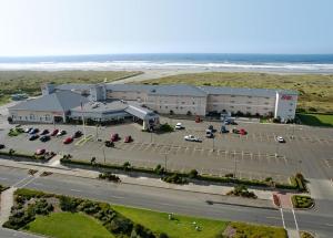 an aerial view of a building with a parking lot at Shilo Inn Suites Ocean Shores in Ocean Shores