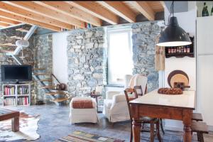Televízia a/alebo spoločenská miestnosť v ubytovaní Holiday Home Vista Lago